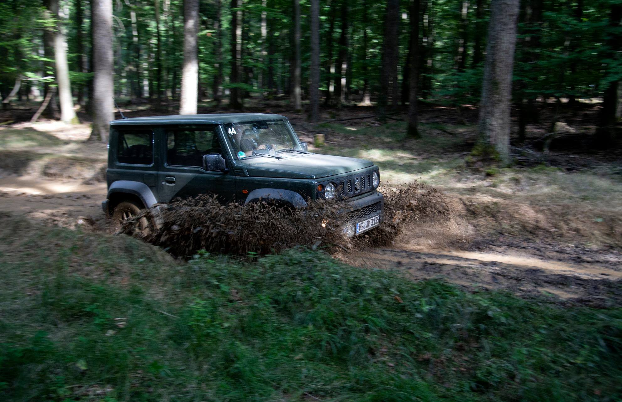 Suzuki Jimny through puddle